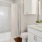 a bathroom with a tub sink and toilet