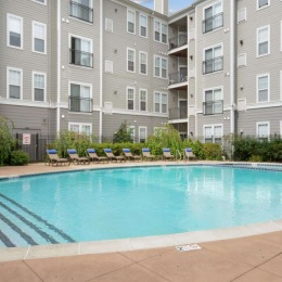 a swimming pool in front of a building