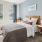 a bedroom with a bed and a table