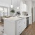 a kitchen with white cabinets