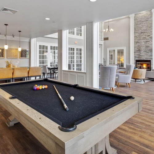 Settle into comfort at Jefferson at Dedham Station Resident lounge at Jefferson at Dedham Station apartments in Dedham, MA, featuring a billiards table.