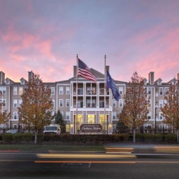 a building with flags on the roof
