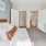 a bedroom with a bed and desk