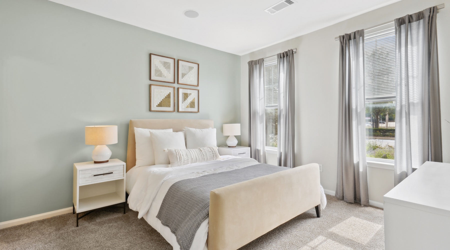 Spacious bedrooms with thoughtful details bedroom with lamps and large windows